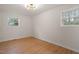 Bedroom featuring hardwood floors, bright lighting, and a well-lit atmosphere at 2607 Nation Ave, Durham, NC 27707