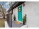 Inviting front entrance with a teal door, welcome mat, and potted plants at 2607 Nation Ave, Durham, NC 27707