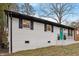 Charming home with a vibrant teal front door and fresh white brick exterior at 2607 Nation Ave, Durham, NC 27707