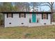 Charming home with a vibrant teal front door and fresh white brick exterior at 2607 Nation Ave, Durham, NC 27707