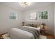 Well lit main bedroom with hardwood floors, picture window, and neutral decor at 2607 Nation Ave, Durham, NC 27707