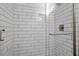 Close-up of a modern shower stall with white subway tile and a clear glass door at 2607 Nation Ave, Durham, NC 27707