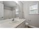 Bright bathroom featuring a white vanity and a window providing natural light at 270 S Ridge Dr, Garner, NC 27529