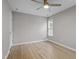 A spacious bedroom featuring hardwood floors, a ceiling fan, and a window at 270 S Ridge Dr, Garner, NC 27529