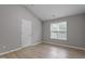 Empty bedroom with neutral paint, a window and a vaulted ceiling at 270 S Ridge Dr, Garner, NC 27529