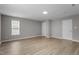 Bonus room featuring wood-look flooring, natural light, and two doors at 270 S Ridge Dr, Garner, NC 27529