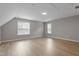 Spacious bonus room featuring hardwood floors and two windows for lots of natural light at 270 S Ridge Dr, Garner, NC 27529