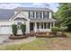Charming two-story home with a welcoming front porch, black shutters, and neat landscaping at 270 S Ridge Dr, Garner, NC 27529