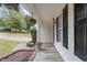 Inviting front porch with wood flooring, black shutters, decorative hanging flower basket, and flower pot at 270 S Ridge Dr, Garner, NC 27529