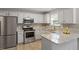 Well-lit kitchen with stainless steel appliances and granite countertops at 270 S Ridge Dr, Garner, NC 27529