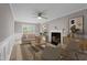 Cozy living room with a fireplace, ceiling fan, and stylish decor at 270 S Ridge Dr, Garner, NC 27529