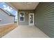 Picture of the back patio and door leading inside, next to the window at 303 Bella Sq, Smithfield, NC 27577