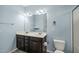 Bright bathroom featuring a double sink vanity with white countertop and modern fixtures at 303 Bella Sq, Smithfield, NC 27577