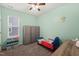 Comfortable carpeted bedroom with lots of storage and natural light from a window at 303 Bella Sq, Smithfield, NC 27577