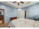 Cozy bedroom features soft lighting, carpeted floors, a walk-in closet, and attached bathroom at 303 Bella Sq, Smithfield, NC 27577