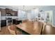 Charming kitchen features dark wood cabinets and stainless steel appliances, creating a modern design at 303 Bella Sq, Smithfield, NC 27577