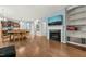 Bright open concept living space with a fireplace, TV, and an adjacent kitchen at 303 Bella Sq, Smithfield, NC 27577
