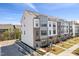 Modern townhome exterior with a mix of brick and siding, offering a contemporary architectural design and street view at 2900 Kempthorne Rd # 57, Cary, NC 27519