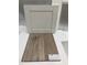 Samples of cabinet and C310Y Heardsville Plus 1056 Driftwood luxury vinyl flooring at 319 Chesapeake Commons St # 103, Garner, NC 27529