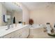 Spacious bathroom with a soaking tub, dual vanity, and separate glass-enclosed shower at 3322 Wellington Ridge Loop, Cary, NC 27518