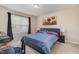 Comfortable bedroom with a queen-sized bed, side tables, and plenty of natural light from the window at 3322 Wellington Ridge Loop, Cary, NC 27518