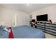 Comfortable bedroom with large closet, a TV, and warm neutral paint colors at 3322 Wellington Ridge Loop, Cary, NC 27518