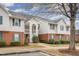 Well-maintained condo building with brick accents and lush landscaping at 3322 Wellington Ridge Loop, Cary, NC 27518