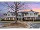 Well-maintained condo building with brick accents and lush landscaping at sunset at 3322 Wellington Ridge Loop, Cary, NC 27518