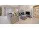 Cozy living room offers a fireplace, plush seating, and plenty of natural light at 3322 Wellington Ridge Loop, Cary, NC 27518