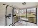 A screened porch featuring outdoor furniture and a view of the parking area at 3322 Wellington Ridge Loop, Cary, NC 27518