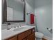 Stylish bathroom features wood vanity with marble top, modern fixtures, and blue walls at 381 Reams Dr, Middlesex, NC 27557