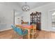 Traditional dining room with hardwood floors, vintage china cabinet, and stylish light fixture at 381 Reams Dr, Middlesex, NC 27557
