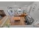 Aerial view of farmhouse style kitchen with wood countertops, stainless steel appliances, and open shelving at 381 Reams Dr, Middlesex, NC 27557