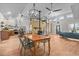 Bright open-plan living area with wood floors, modern furnishings, spiral staircase, and farmhouse-style kitchen at 381 Reams Dr, Middlesex, NC 27557