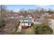 Aerial view of the property showcasing the home and backyard with deck at 405 N Hyde Park Ave, Durham, NC 27703
