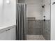 Bathroom showcasing a tiled shower with dark hardware at 405 N Hyde Park Ave, Durham, NC 27703
