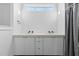 Modern bathroom featuring a double sink vanity and inset lighting at 405 N Hyde Park Ave, Durham, NC 27703