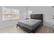 Bright bedroom with natural light, wood floors, and a minimalist design at 405 N Hyde Park Ave, Durham, NC 27703