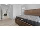 Light and airy bedroom with a wood-framed bed and doorway at 405 N Hyde Park Ave, Durham, NC 27703