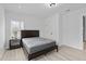 A cozy bedroom with a minimalist design features natural light and clean lines at 405 N Hyde Park Ave, Durham, NC 27703