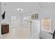 A versatile bonus room with abundant natural light from multiple windows and neutral decor at 405 N Hyde Park Ave, Durham, NC 27703