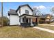 Charming two-story home with a classic white exterior, black trim, and inviting front porch at 405 N Hyde Park Ave, Durham, NC 27703