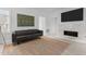A stylishly decorated living room featuring a marble fireplace and an open-concept design for comfortable living at 405 N Hyde Park Ave, Durham, NC 27703