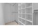 Spacious walk-in closet with built-in shelving and hanging rods at 405 N Hyde Park Ave, Durham, NC 27703