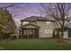 Exterior view of a home with a spacious backyard and screened-in porch at 414 Travertine Dr, Cary, NC 27519