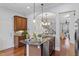 Stylish kitchen featuring granite countertops, stainless steel appliances, and hardwood floors at 414 Travertine Dr, Cary, NC 27519