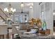 Close-up of kitchen island with marble countertop and decorative wine glasses at 414 Travertine Dr, Cary, NC 27519