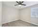 Bedroom featuring modern flooring, a ceiling fan, and bright windows at 4436 Talcott Dr, Durham, NC 27705