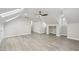 Spacious bonus room with vaulted ceilings, skylights, and light wood-look flooring at 4436 Talcott Dr, Durham, NC 27705