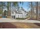 An alternate view of the house, showing the 2-car garage, driveway, and entrance at 4436 Talcott Dr, Durham, NC 27705